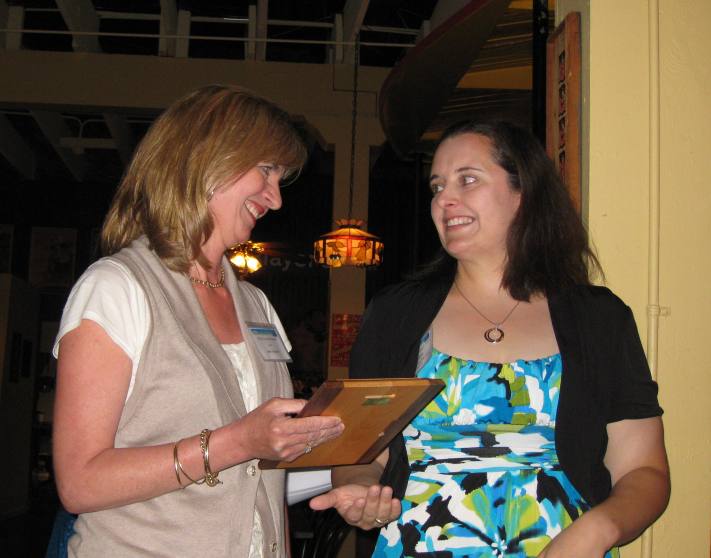 Jane Tragesser presenting the May is Better Hearing & Speech Month Award to Tiffany Blakley, a special education teacher at Hidden Hollow Elementary in Humble ISD.