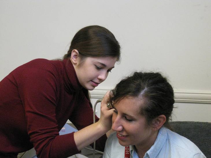 Graduate clinician conducting impedance screening