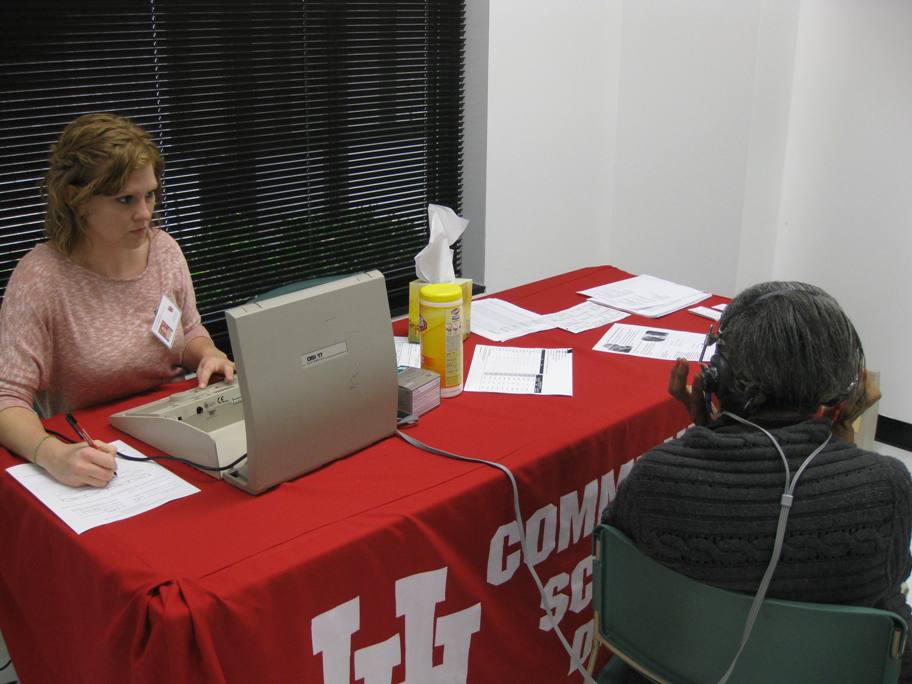 Graduate clinician, Kristen Lehmer, conducting a hearing screening