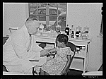 Dr. William J. Buck administering a typhoid vaccine