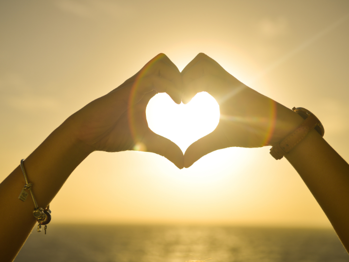 two hands making a heart