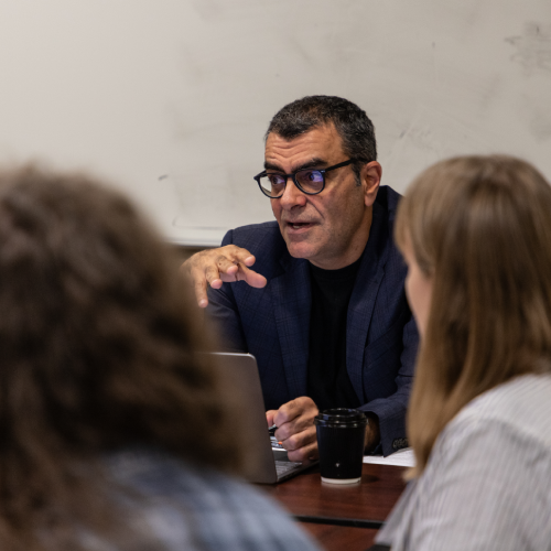 Professor talking with students