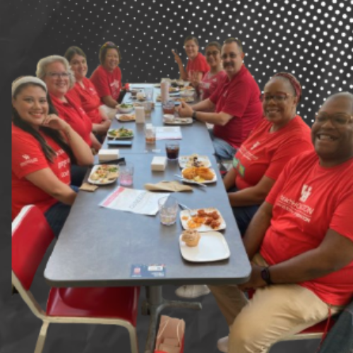 UH staff council members sitting at a lunch table