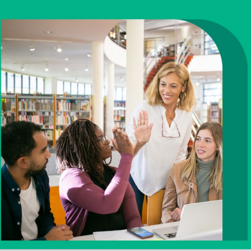 professional team high fiving at a table 