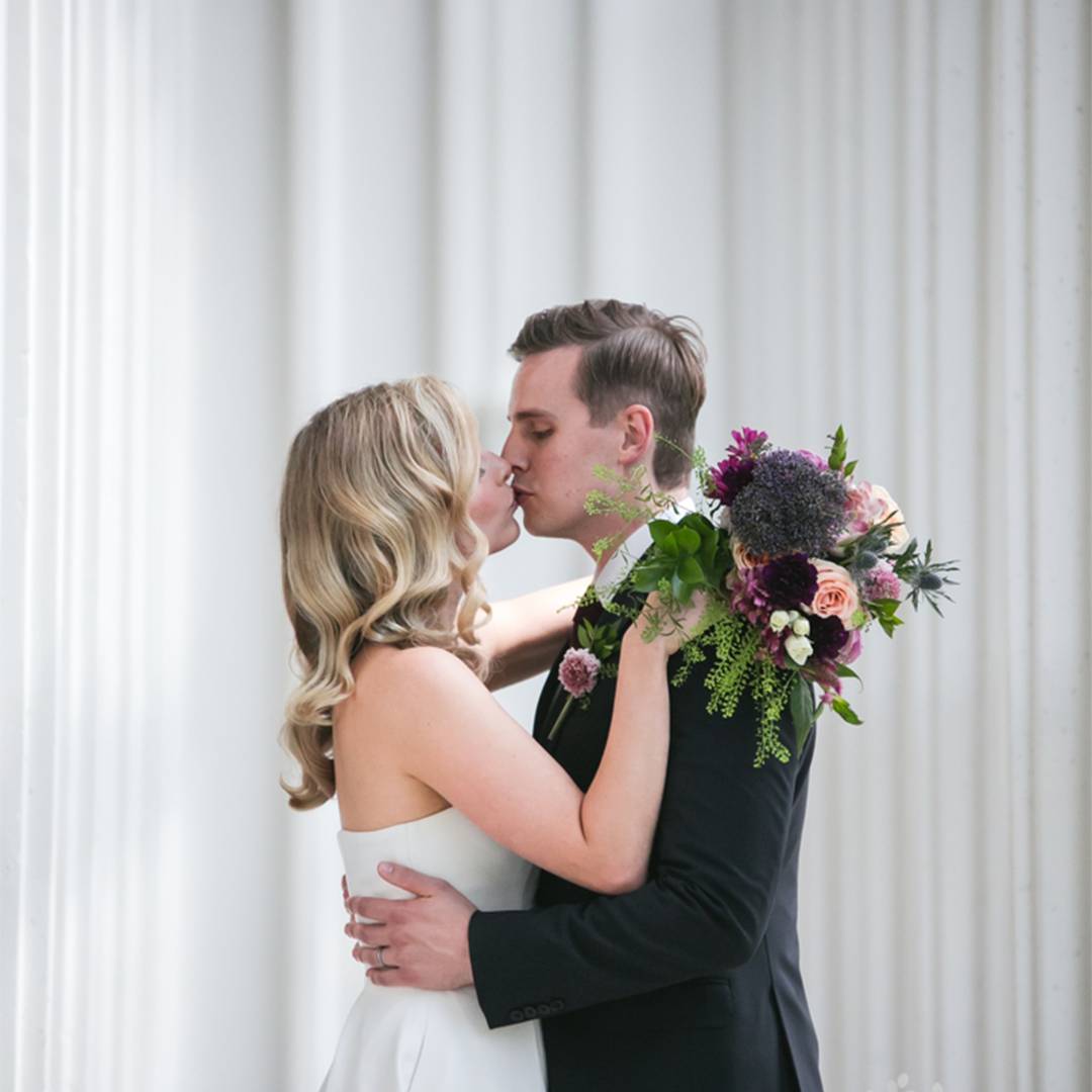 Bride and groom kissing