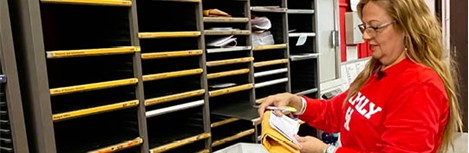 Postal person sorting mail