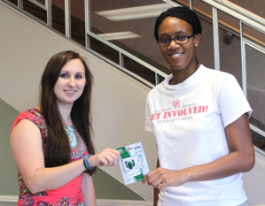 Bia Patterson, right, receives her gift card from Office of Sustainability Program Manager Sarah Kelly.