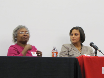 Panelist Mary van Manen (left) tells of the discrimination and isolation she experienced growing up in Mississippi, while panelist Mary Perrodin pays close attention to the story unfolding from van Manen’s fingertips.