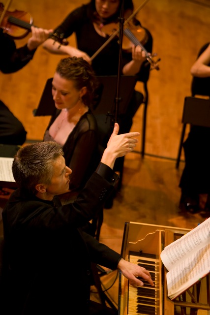 Matthew Dirst conducting the orchestra 