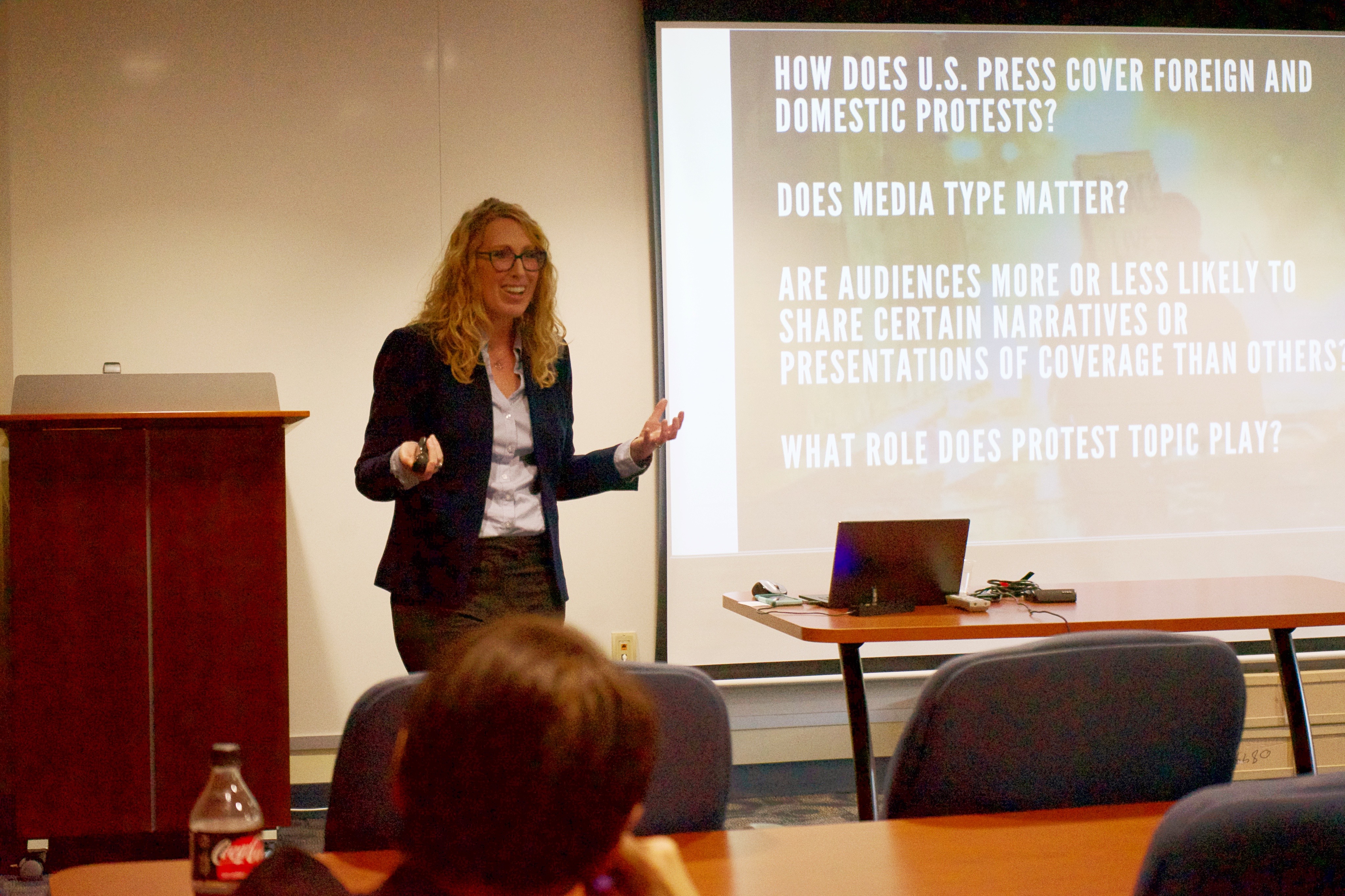Photograph of Dr. Summer Harlow giving her talk on the protest paradigm at M.D. Anderson Library. 