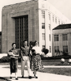 3 students in front of E-Cullen bldg - archive image from UH Digital Library