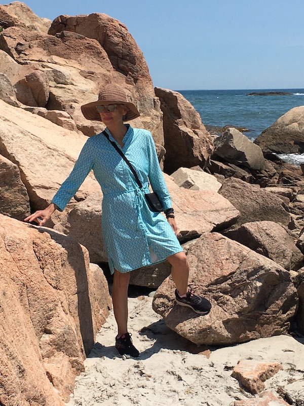 Dr. Christensen's photo wearing a sundress on a beach