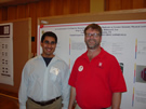 Graduate student Jorge Banda and Dr. Layne in front of their poster.