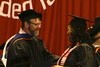 Dr Layne congratulating graduating students 