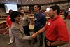 Doctoral student Chris Arellano greets President Khator