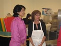 Dr. Renu Khator getting a tour of Shasta's kitchen with Chef Laura Moore