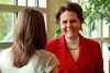 Joan Ifland talking with a conference attendee