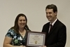 Dr. Thrasher presenting the outstanding Master of Education student in Health award to Stephanie Paulk