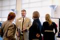 Dr. Layne answers questions at the reception 