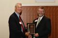 Dr. Layne congratulates Mr. James Patterson on winning the Distinguished Alumnus of the Year award 