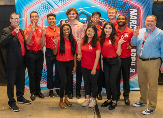 Sport administration students and faculty pose in front of NCAA backdrop. Sport administration students and faculty pose in front of NCAA backdrop.