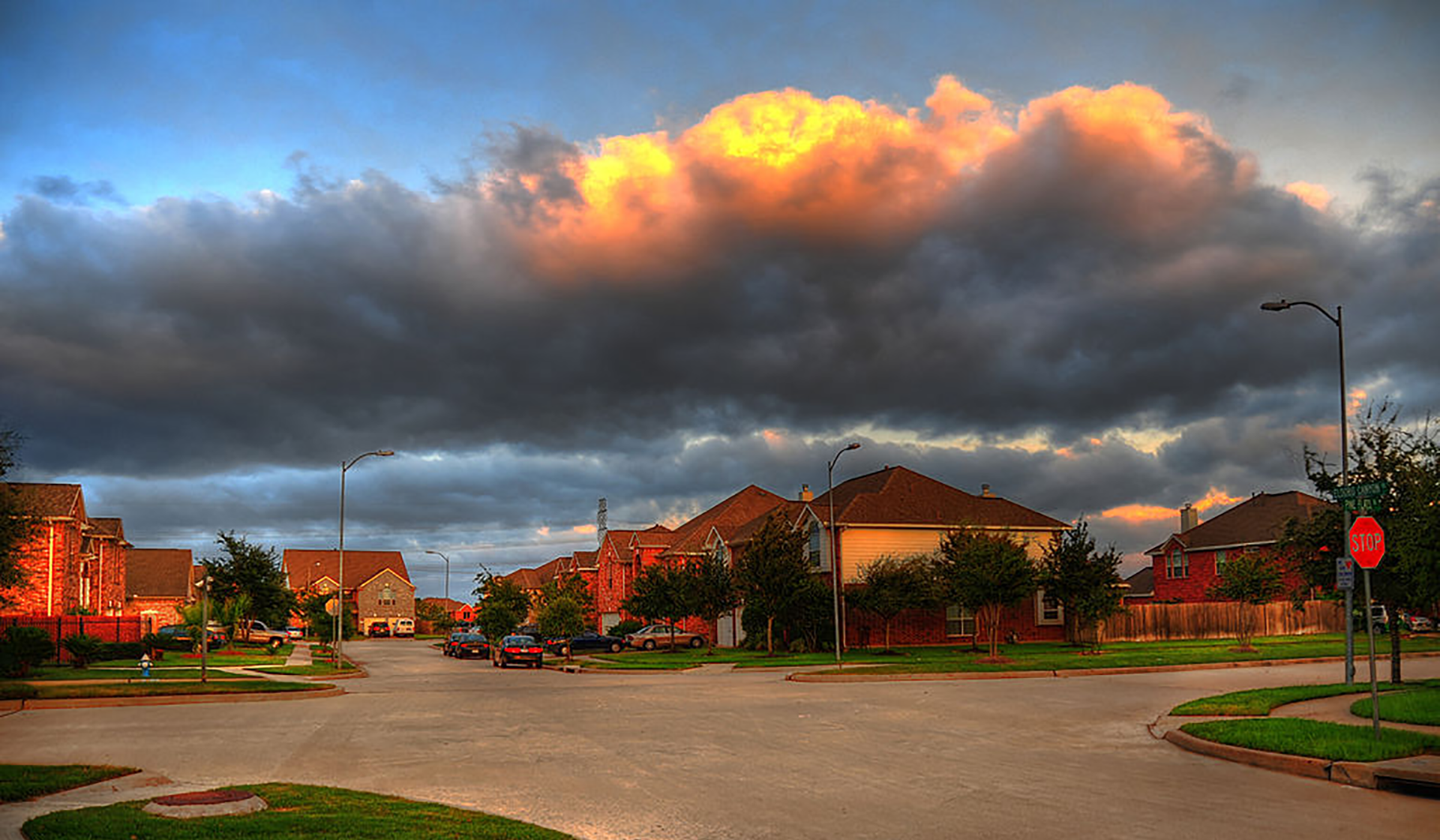 Storm clouds on the horizon, with houses on the frontground