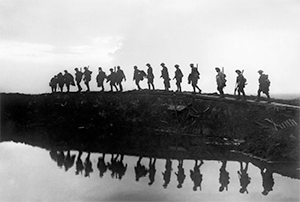 Supporting troops of the 1st Australian Division walking on a duckboard track near Hooge, in the Ypres Sector