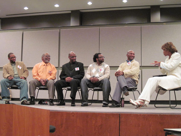 The full panel with moderator Assistant Professor Sharon Grigsby Hill