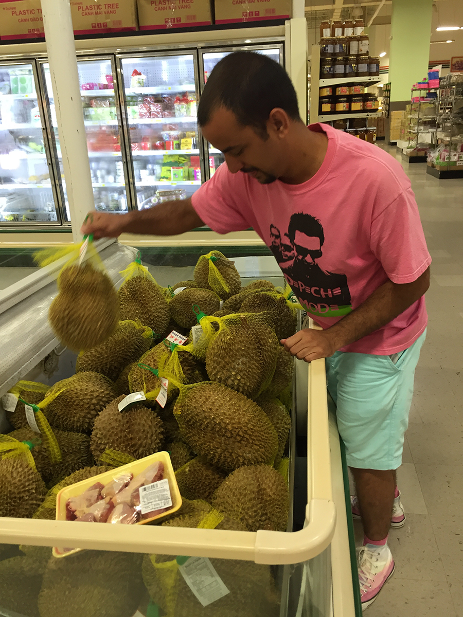 Student examines items for sale at a Houston-area ethnic market as part of the study abroad at home course.