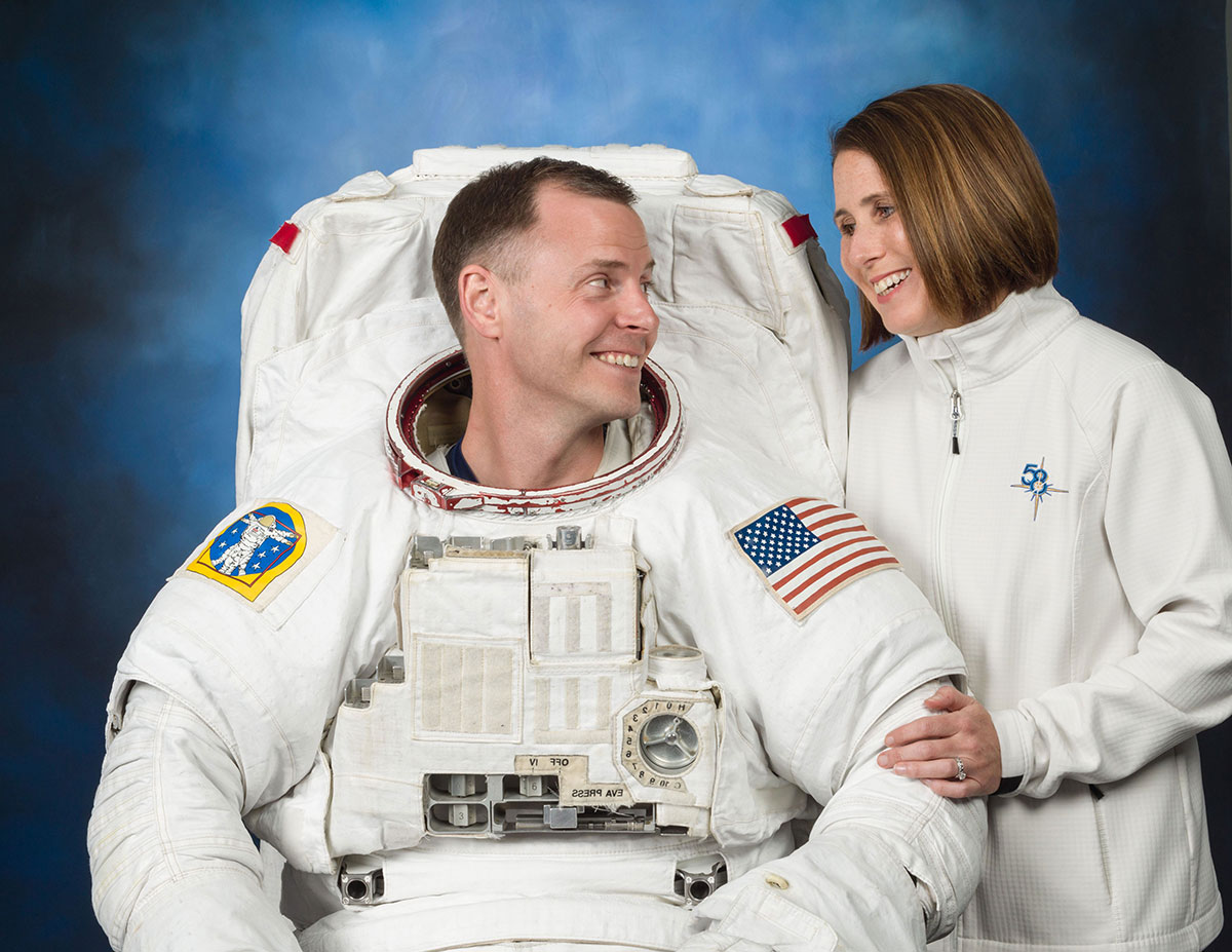 Astronaut Hague in suit next to wife