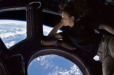 Astronaut Tracy Caldwell Dyson thinking in space---self-portrait from Wikimedia Commons