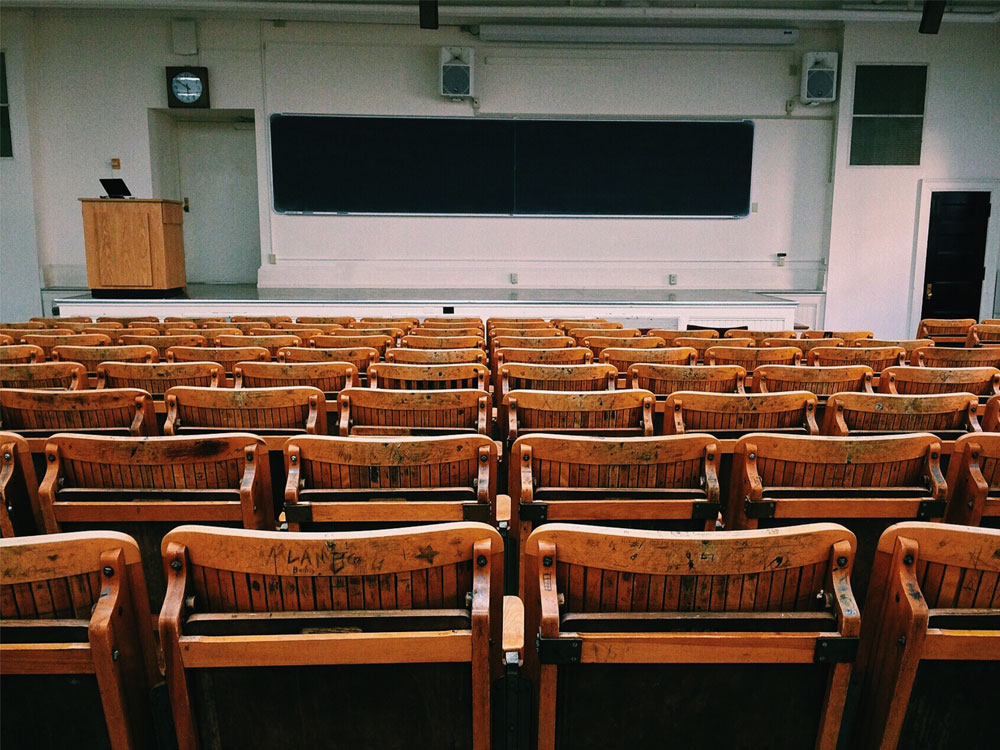 Empty classroom with wooden desks