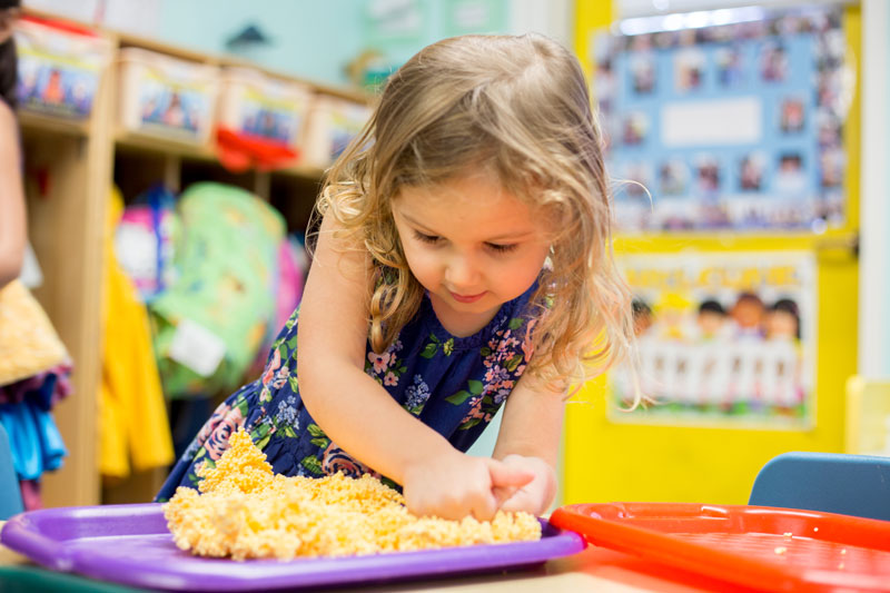 child playing with clay