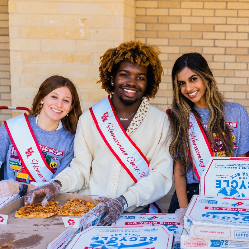 Handing out pizza