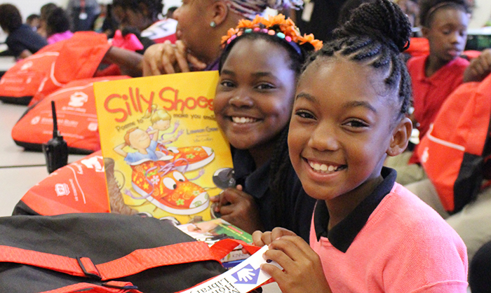 Two students getting books at Blackshear Elementary School