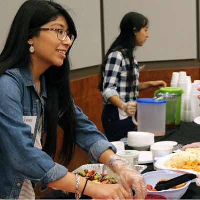 Female volunteer giving out food