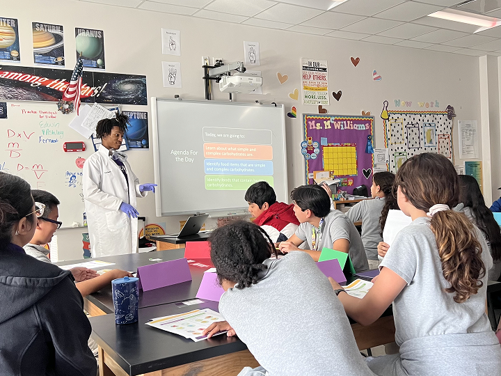 Intern giving a lecture to a group of students