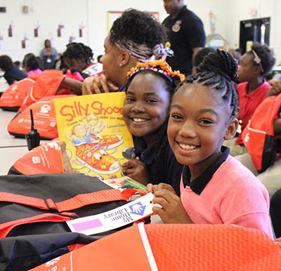 Two girls from Blackshear Elementary holding books