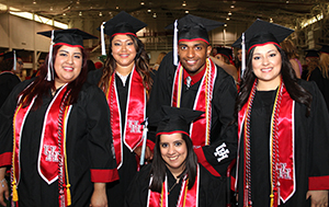 Students posing at the Athletics Center before Convocation