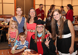 A family at the Graduate Graduation Reception