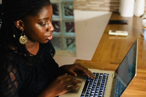 Black woman at a laptop