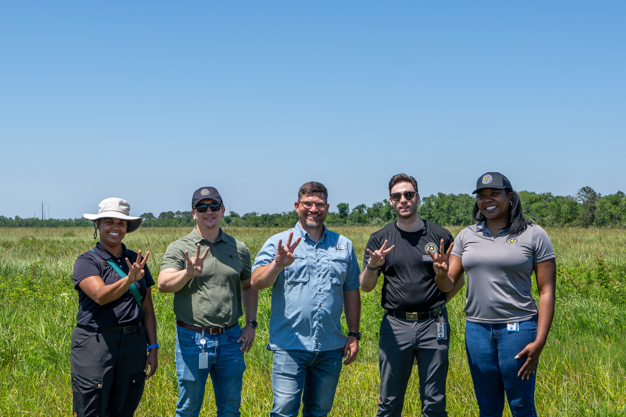 Matthew Abernathy (center) with HCP4 operations team during Coastal Center visit