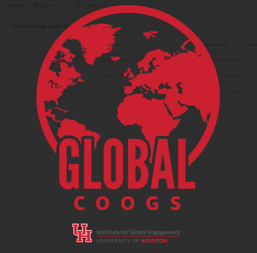 hand making coogs sign over globe