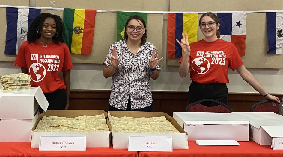 Students serving global desserts