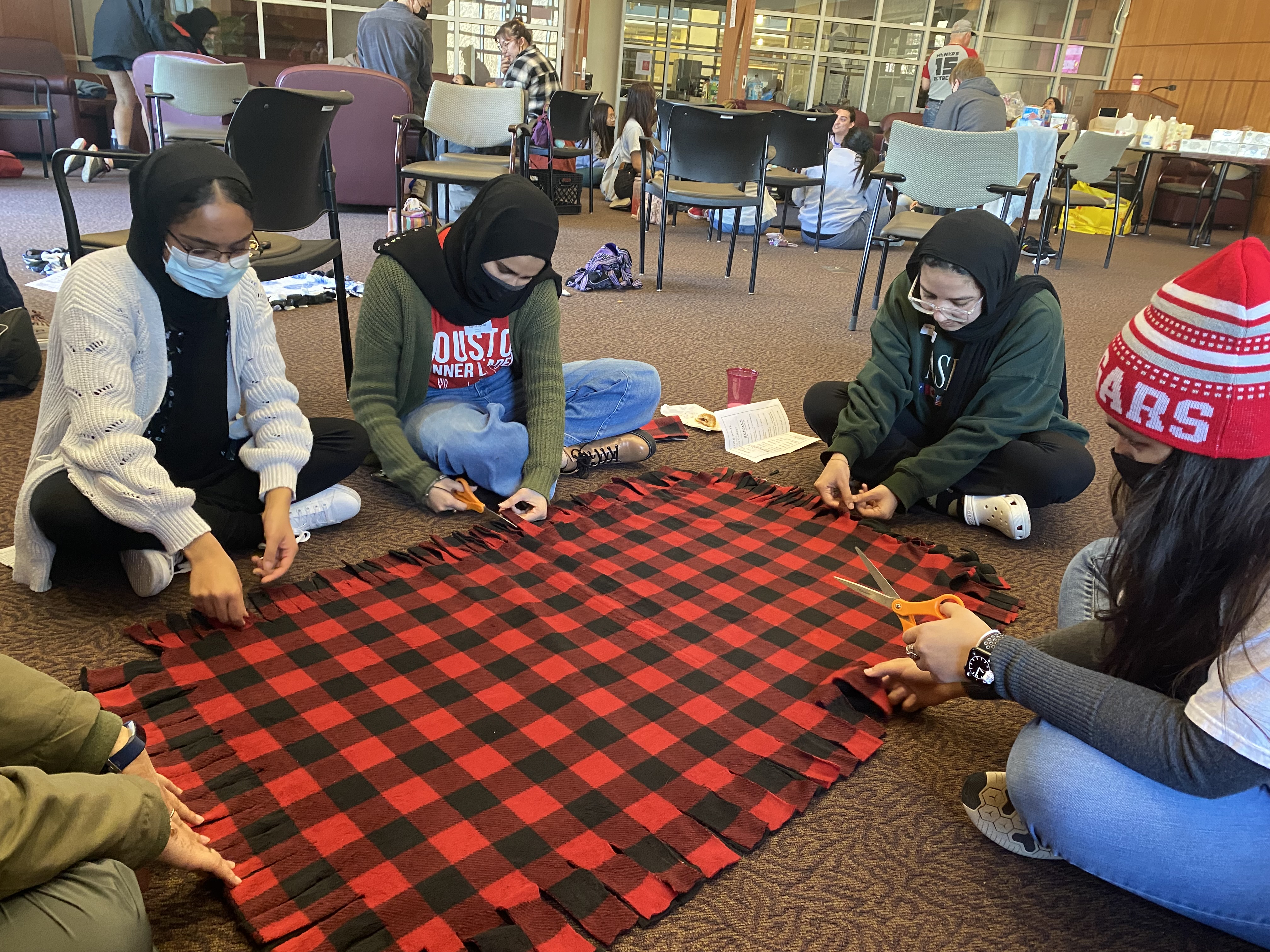 Students making blankets to donate
