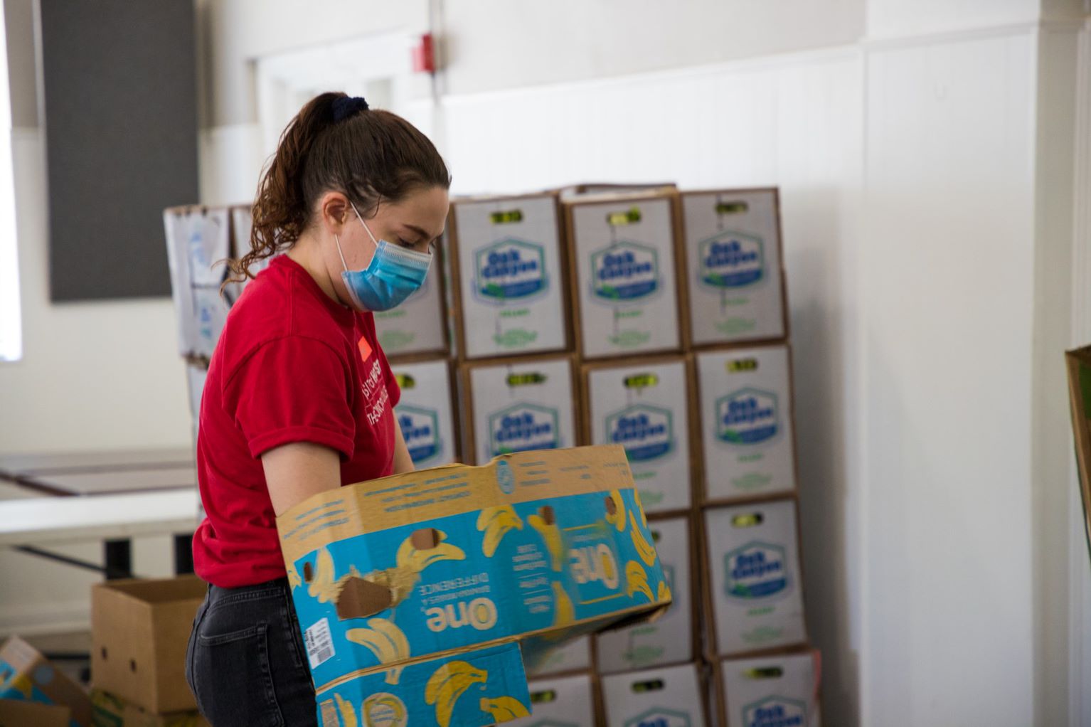 student working at food distribution site