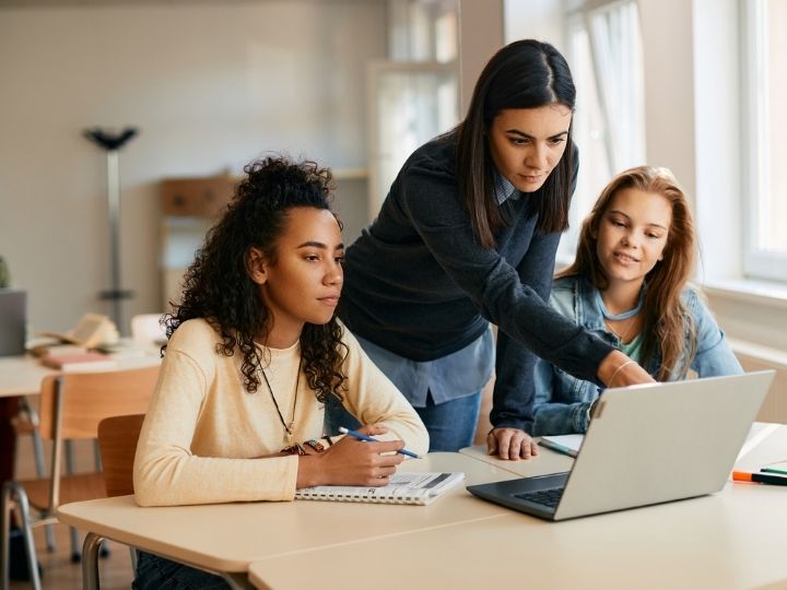 Photo of teacher and students in classroom