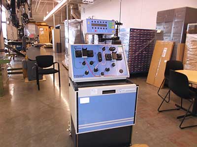 A large piece of biotechnology equipment in a workshop.