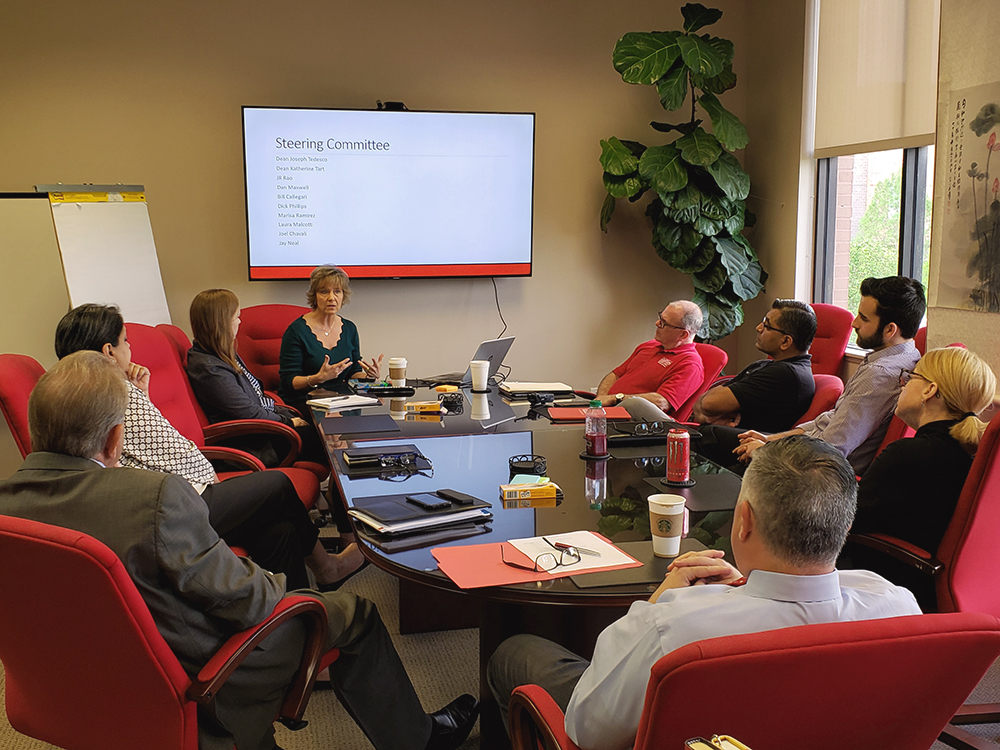 A group of people at a conference table