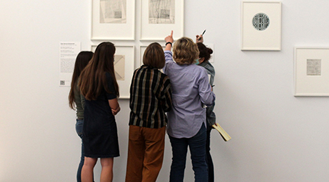 Students looking at artwork at MFAH